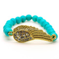 Bracelet de pierres précieuses étirées de perles rondes turquoise 8MM avec morceau d&#39;aile Diamante